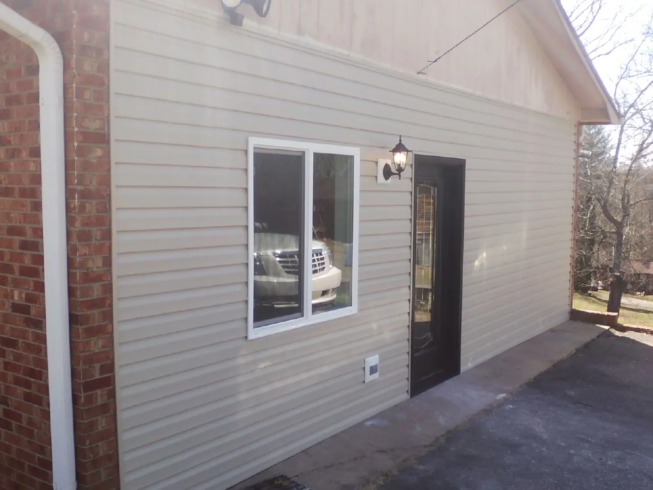 New vinyl siding and entry door on a room addition in Sherman Oaks
